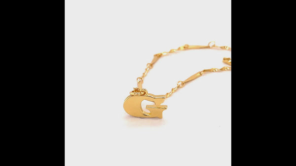 360 video of the letter G necklace. Video focuses on the letter pendant and shows both the front and the back with the signature wave design. Also in the video, the gold twisted chain.